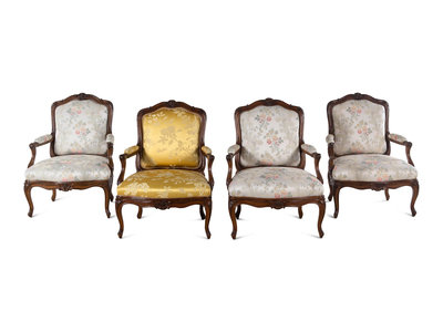 Past auction: Two Louis XV carved beechwood fauteuils with faux