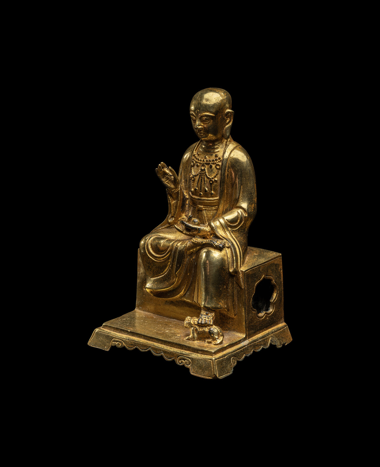 A Chinese Gilt Bronze Figure of a Seated Monk