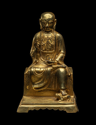 A Chinese Gilt Bronze Figure of a Seated Monk