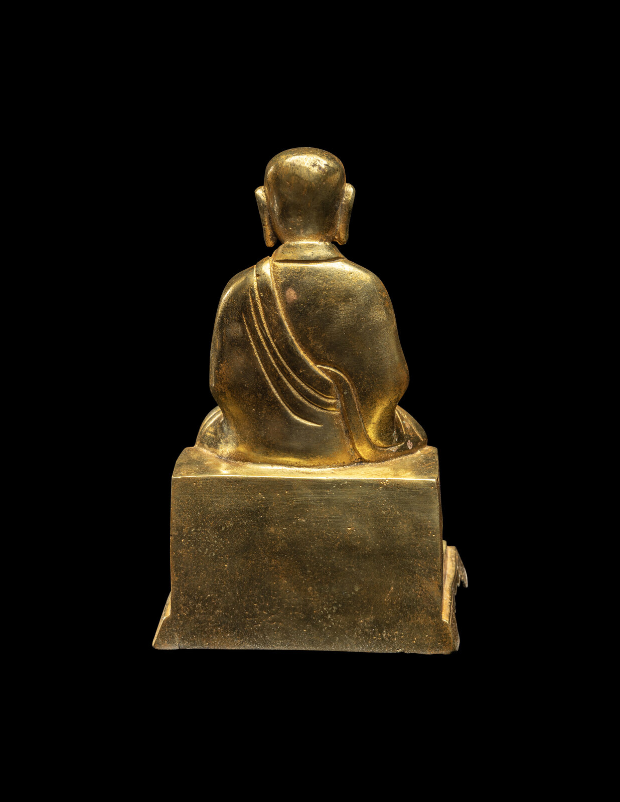 A Chinese Gilt Bronze Figure of a Seated Monk